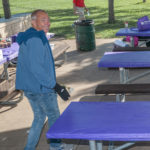 Man smiling at a Purple Stride walk event