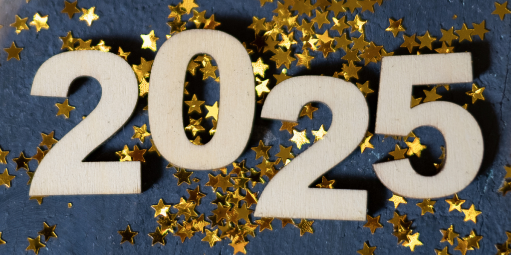 Image of "2025" in wooden letters with glitter in the background.